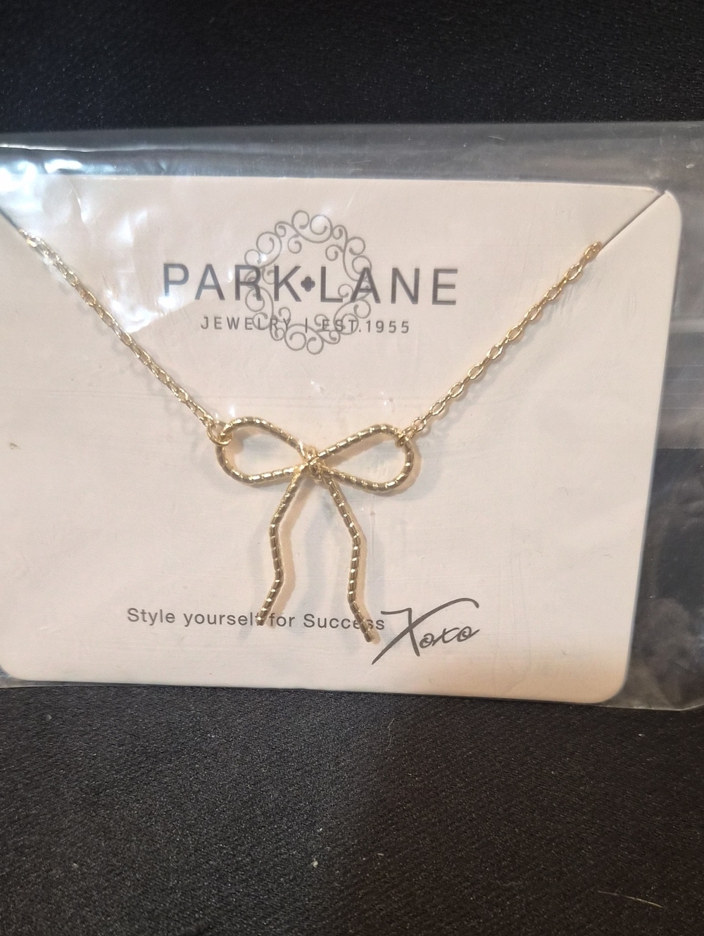 Necklace with bow pendant